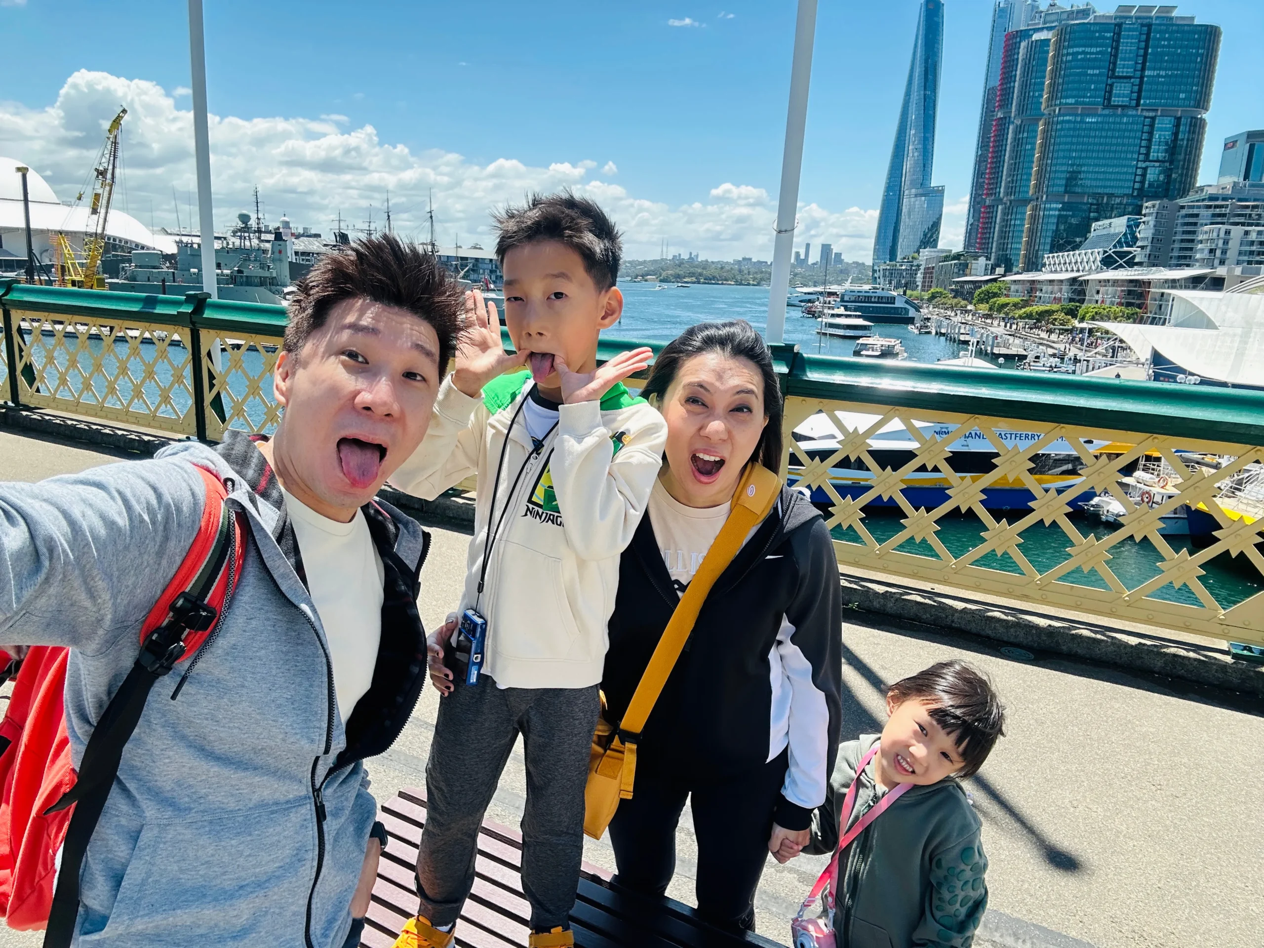 Clarry and his family sharing a playful moment by the harbour
